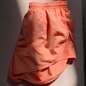 coral pink dry fit Nike running shorts